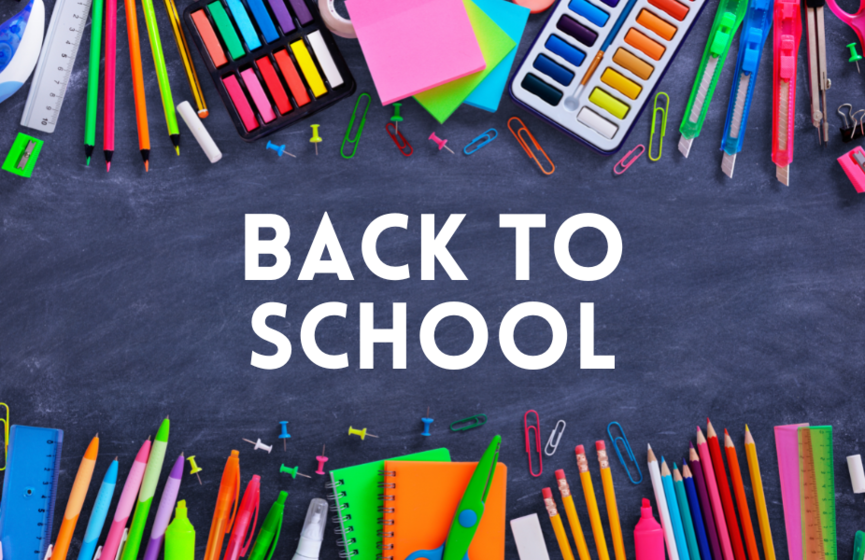 Colourful school supplies laying on a flat chalk board with text reading Back to School